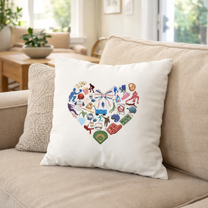 Decorative pillow with heart design on a beige couch in a living room.
