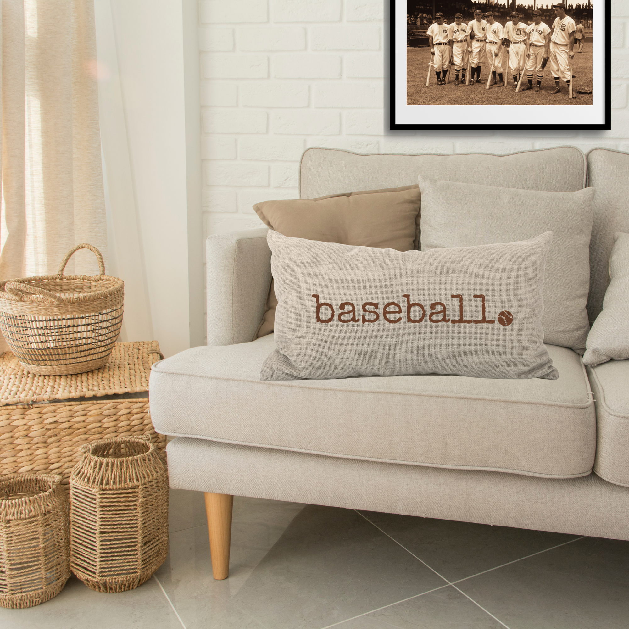 decorative beige pillow in a living room setting with the word baseball in a distressed typewriter font
